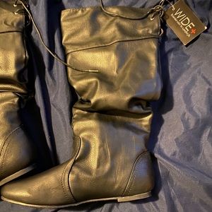 Wide calf over the knee lace up boot